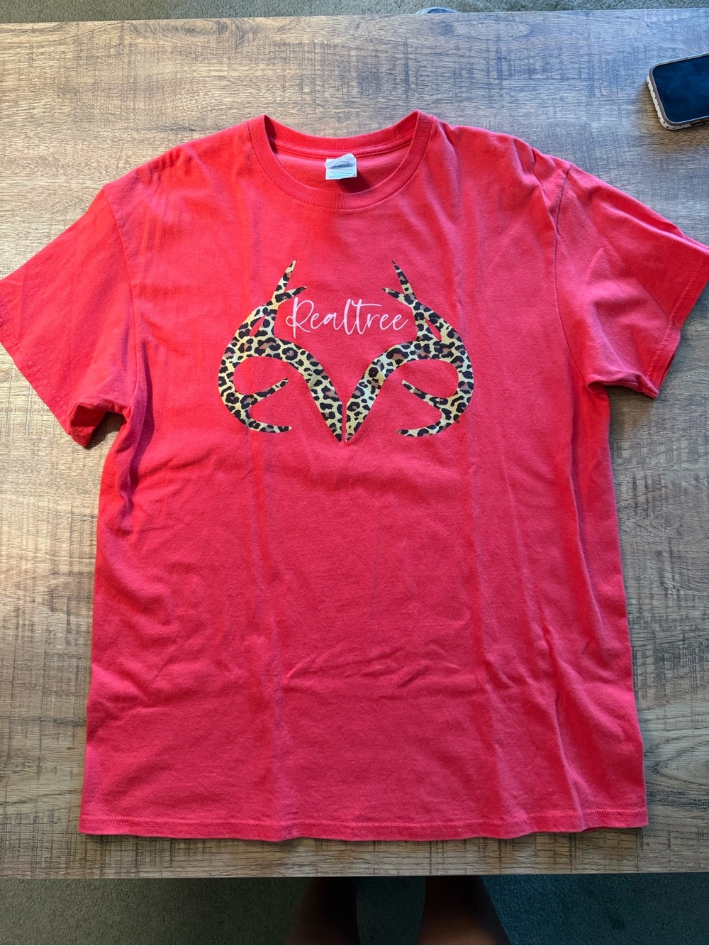 Leopard print Realtree logo on a pink shirt